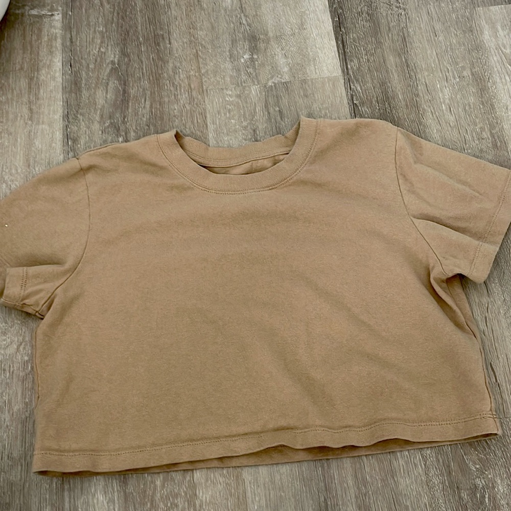 I am selling a tan crop top. It is from urban outfitters and a size small!